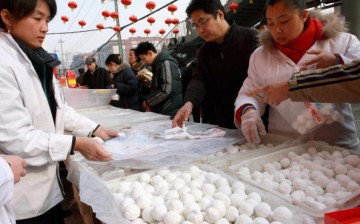 Customers buying glutinous rice balls in Beijing, China.