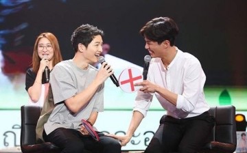 Song Joong-Ki and Park Bo-Gum laugh during the fan meeting of the latter in Bangkok, Thailand on Feb. 11, 2017.