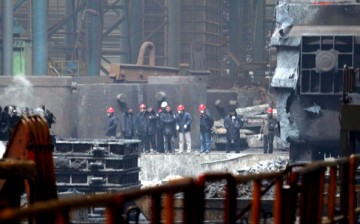 Investigators check the damaged steel casting workshop owned by state-run Angang Heavy Machinery in the city of Anshan in Liaoning Province.