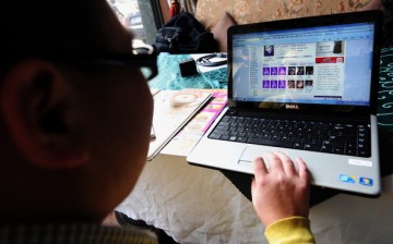 Beijing office worker surfs the Internet looking for love at a cafe in Beijing.