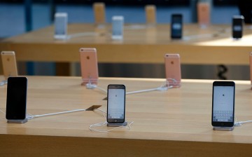 Apple Inc. iPhones including iPhone SE, center front, are displayed at the company's Omotesando store.