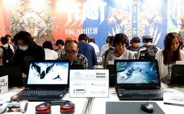 Visitors play the Final Fantasy XIV in the Square Enix Co. booth at Tokyo Game Show on September 17, 2016 in Chiba, Japan.