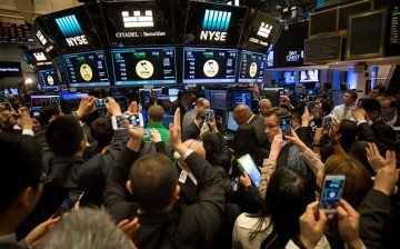 Traders work on the floor during the IPO of China Online Education Group at the New York Stock Exchange.