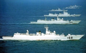 The Type 052B destroyers CNS Guangzhou (168) and CNS Wuhan (169), and the Type 052C destroyer CNS Haikou (171) with ships of the China Coast Guard.     