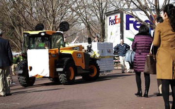 Bao Bao the Panda is escorted inside a FedEx transport vehicle.