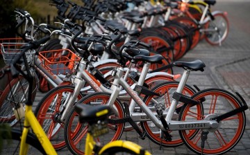 A photo that shows bicycles of the Mobike and Ofo sharing companies on the street in Shanghai.