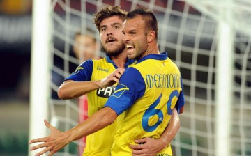 Chievo forward Riccardo Meggiorini (R) with teammate Alberto Paloschi.