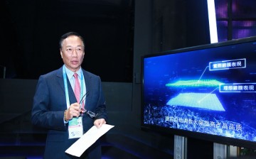 Terry Gou Tai-ming, founder and chairman of Taiwan's Foxconn Technology, speaks at the Foxconn booth during the 3rd World Internet Conference.