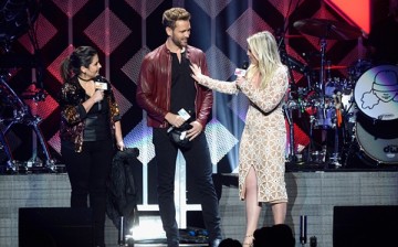 Radio personality Sisanie, 'The Bachelor' star Nick Viall and radio personality Tanya Rad speak onstage during 102.7 KIIS FM's Jingle Ball 2016 at Staples Center on December 2, 2016 in Los Angeles, California.