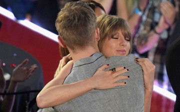 Recording artist Taylor Swift (R) hugs Calvin Harris at the iHeartRadio Music Awards which broadcasted live on TBS, TNT, AND TRUTV from The Forum on April 3, 2016 in Inglewood, California.