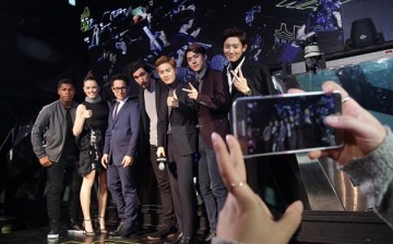 John Boyega, Daisy Ridley, J.J. Abrams and Adam Driver pose for their selfie with South Korean boy band EXO during the event for fans ahead of 'Star Wars: The Force Awakens' South Korea premiere.
