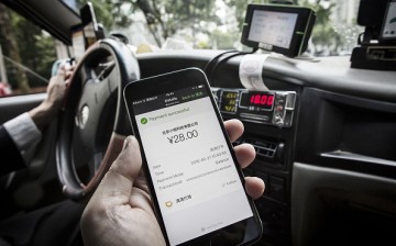 The payment confirmation page is displayed on the Didi Chuxing application in this arranged photograph taken in Shanghai, China.