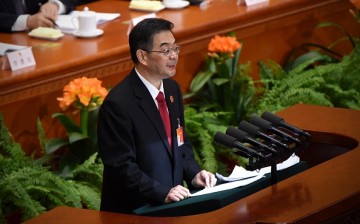 Zhou Qiang, President of the Supreme People's Court of China, delivers his work report to the National People's Congress at the Great Hall of the People in Beijing, March 12, 2017.
