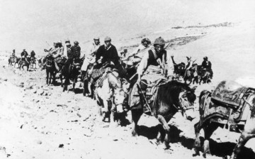 The 14th Dalai Lama flees from Tibet to India across the Himalayas, following a failed uprising against the Chinese occupation, 1959. He is riding a white pony, third from the right.