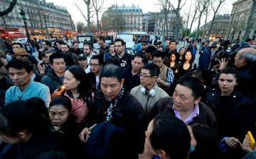 People gather during a demonstration for justice on the Place de la Republique (Republic's Square) on March 30, 2017 following the death of Chinese Liu Shaoyo during a police intervention.
