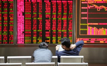 Investors observe stock market movements at an exchange hall on Jan. 6, 2016, in Beijing, China.