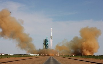 The Long March-2F rocket blasts off from the launch pad at the Jiuquan Satellite Launch Center on June 11, 2013, in Jiuquan, Gansu Province, China.