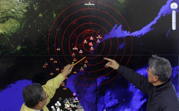 South Korean officials point to the screen to show seismic waves from North Korea at the Korea Meteorological Administration center on Jan. 6, 2016, in Seoul, South Korea. 