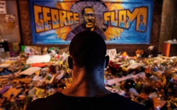  A man recites spoken word poetry at a makeshift memorial honoring George Floyd, at the spot where he was taken into custody, in Minneapolis, Minnesota, U.S.