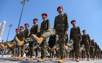 Houthi soldiers march during a funeral procession for Houthi fighters killed in recent fighting against government forces in Marib province, in Sanaa,