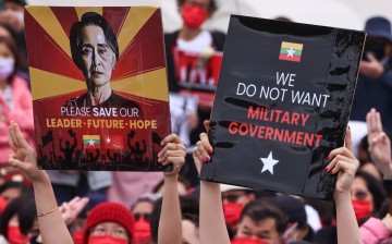 People hold placards as they gather to denounce the Myanmar military coup, in Taipei, Taiwan 