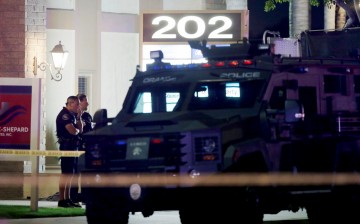 Police officers respond to the scene of a shooting in Orange, California, U.S.