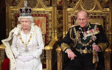 Britain's Queen Elizabeth waits to read the Queen's Speech to lawmakers in the House of Lords, next to Prince Philip