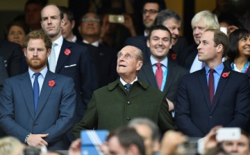 Britain's Prince Harry, Prince Philip and Prince William (L-R) attend the Rugby World Cup final match between New Zealand against Australia at Twickenham in London, 