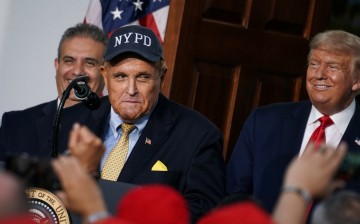 Former New York City Mayor Rudy Giuliani speaks alongside U.S. President Donald Trump during remarks to the City of New York Police Benevolent Association 