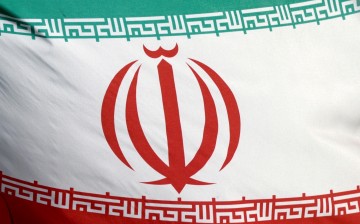 The Iranian flag waves in front of the International Atomic Energy Agency (IAEA) headquarters in Vienna, Austria