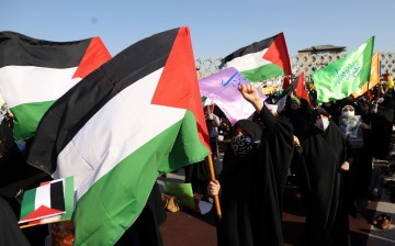 People gather during a demonstration to express solidarity with Palestinian people amid a flare-up of Israeli-Palestinian violence, in Tehran, Iran