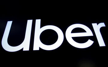 A screen displays the company logo for Uber Technologies Inc. on the day of it's IPO at the New York Stock Exchange (NYSE) in New York, U.S.