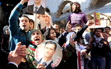 Supporters of Syria's President Bashar al-Assad attend a rally in Damascus 