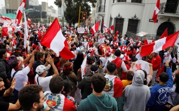 Supporters of Peru's presidential candidate Keiko Fujimori gather on a street near the National Office of Electoral Processes