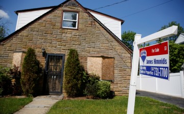 A 'for sale' is seen outside a single family house in Garden City, New York, U.S