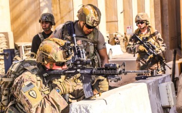 U.S. Army soldiers from 1st Brigade, 25th Infantry Division, Task Force-Iraq, man a defensive position at Forward Operating Base Union III in Baghdad, Iraq,