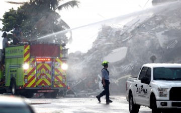 Emergency crews continue search and rescue operations for survivors of a partially collapsed residential building in Surfside,