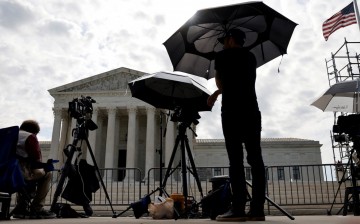 Television news photographers prepare to cover the final opinions of the current court’s term at the U.S. Supreme Court building in Washington, U.S.