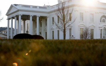 A general view of the sun rising behind the White House in Washington, U.S