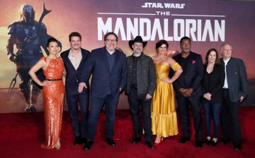 Creator Jon Favreau (3rd L), President of Lucasfilm Kathleen Kennedy (2nd R), executive producer Dave Filoni (C) pose with cast members (L-R) Ming-Na Wen, 