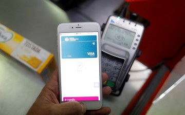 A shopper uses the mobile payment service Apple Pay at a supermarket, amid the coronavirus disease (COVID-19) outbreak, in Ronda, 