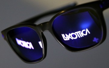 The Luxottica name is reflected in a pair of sunglasses in this photo illustration taken in Rome 