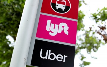 A sign marks a rendezvous location for Lyft and Uber users at San Diego State University in San Diego, California, U.S.