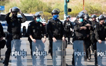 Police block protesters during a visit by U.S, President Donald Trump to the Dream City Church in Phoenix, Arizona, U.S.