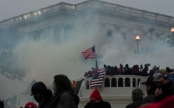 Police clear the U.S. Capitol Building with tear gas as supporters of U.S. President Donald Trump gather outside, in Washington, U.S.