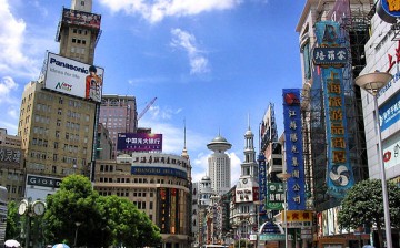 Nanjing Road flanked by buildings and establishments that signify China's performing economy.
