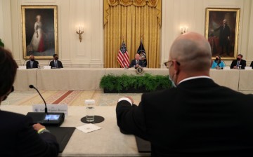 U.S. President Joe Biden delivers remarks as he meets with members of his national security team and private sector leaders to discuss how to 