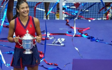 Sep 11, 2021; Flushing, NY, USA; Emma Raducanu of Great Britain celebrates with the championship trophy after her match against Leylah Fernandez of Canada (not pictured)