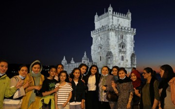 The captain of Afghanistan's national women football team Farkhunda Muhtaj (C) poses for a portrait with teammates at the Belem Tower in Lisbon, Portugal,