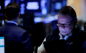 Traders work on the floor of the New York Stock Exchange (NYSE) in New York City, U.S.,